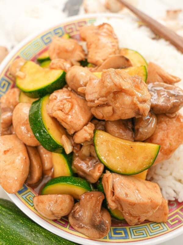 Mushroom chicken on a plate with rice.