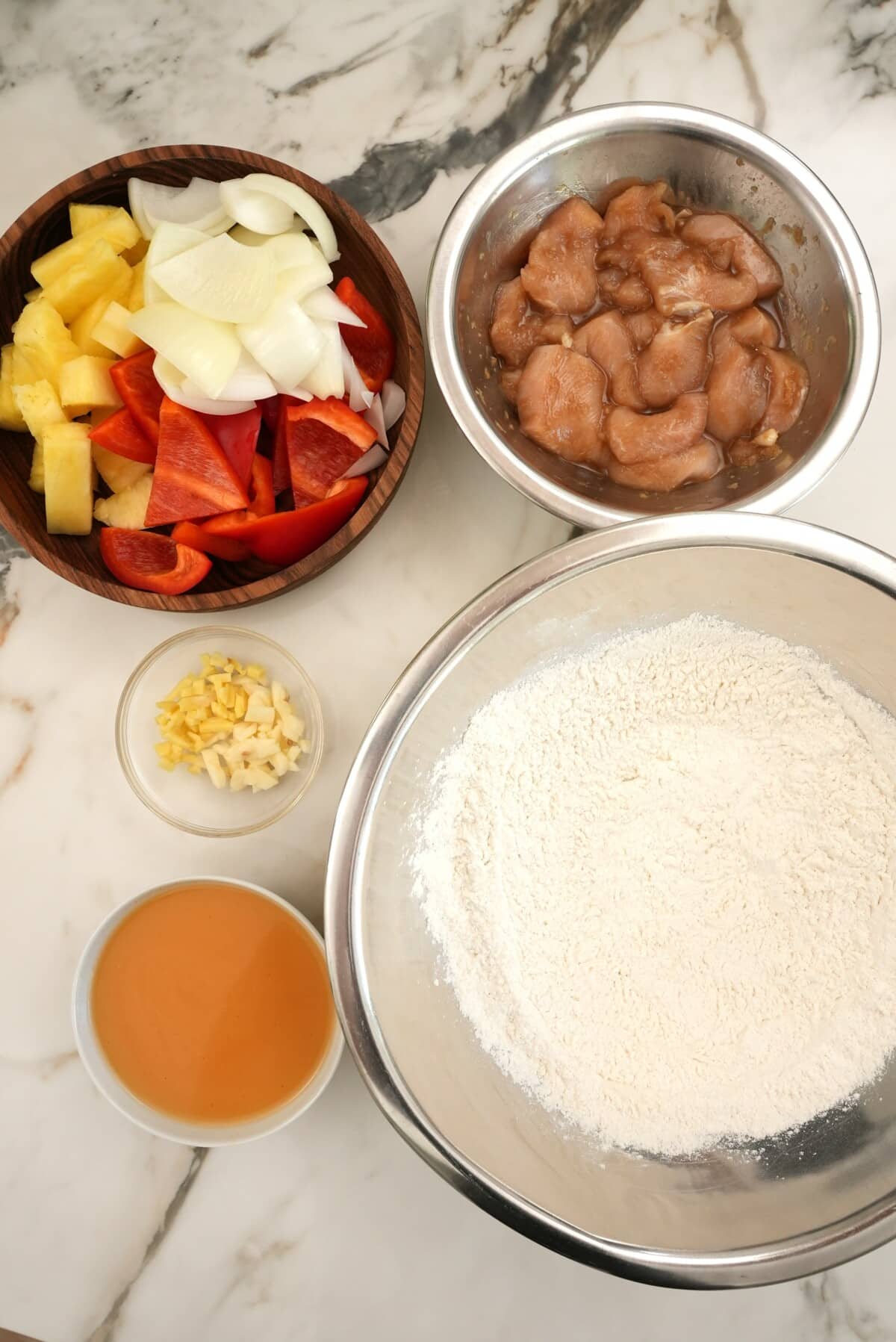 Raw ingredients for Sweetfire Chicken Breast on a table.