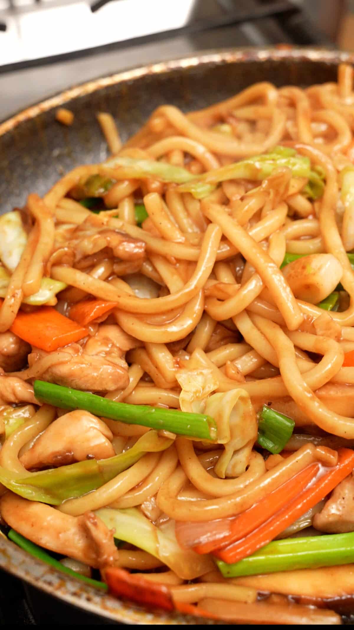 Yaki Udon cooking in a pan.