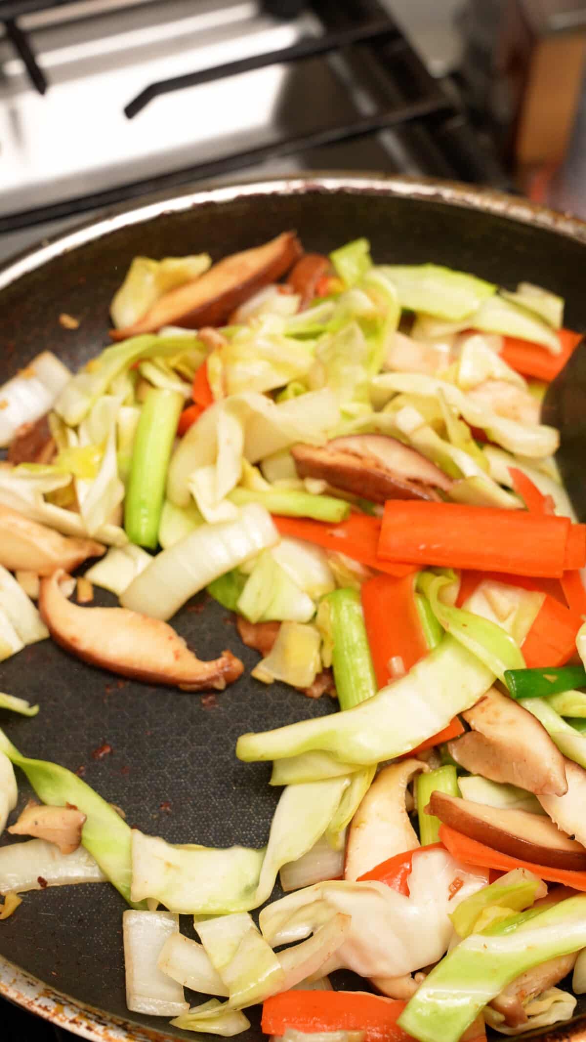 Stir fried vegetables in a pan.