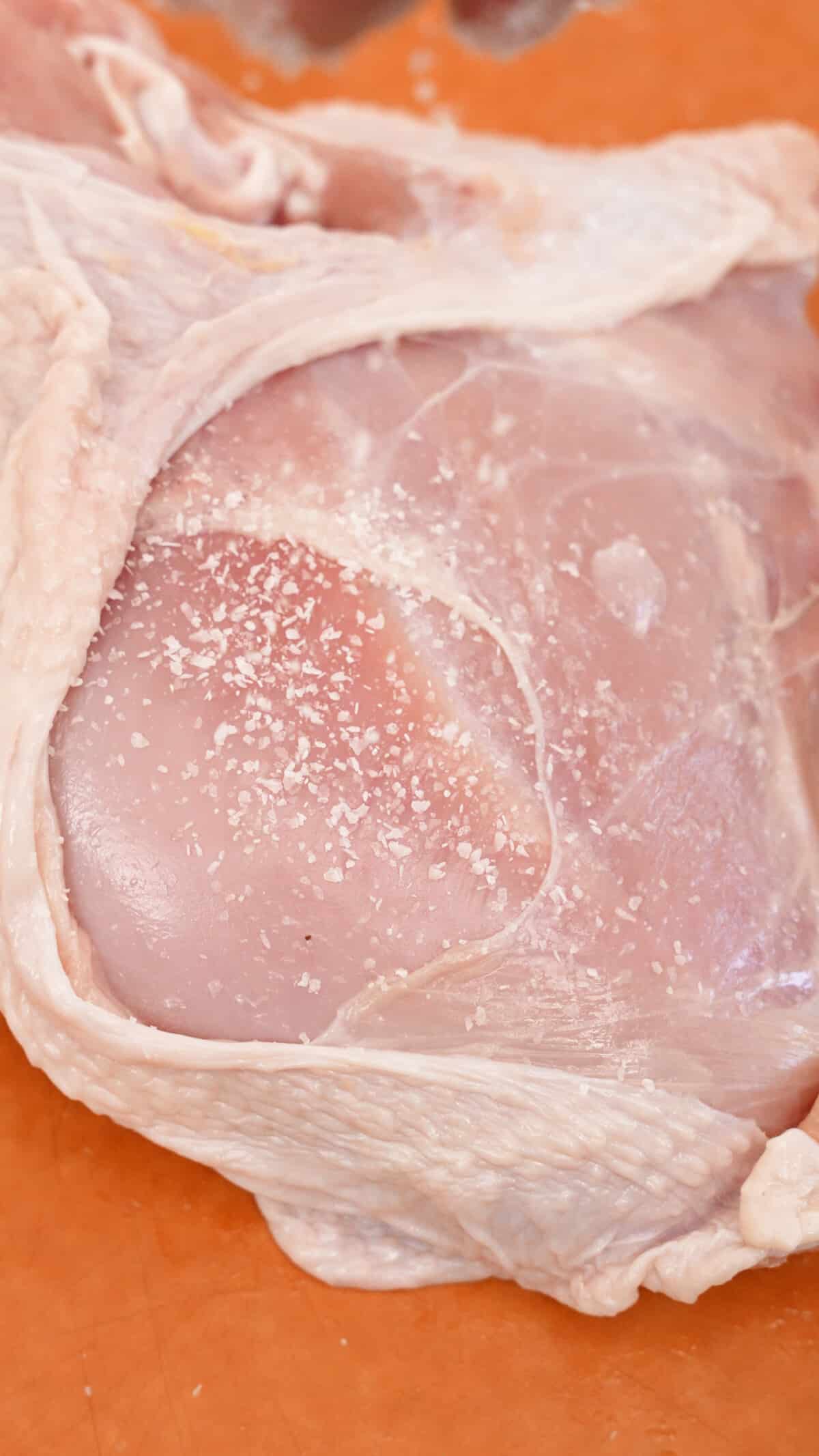 Kosher salt seasoned on the turkey breast meat underneath the skin.