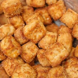 Crispy Air Fryer Tofu seasoned in a bowl.