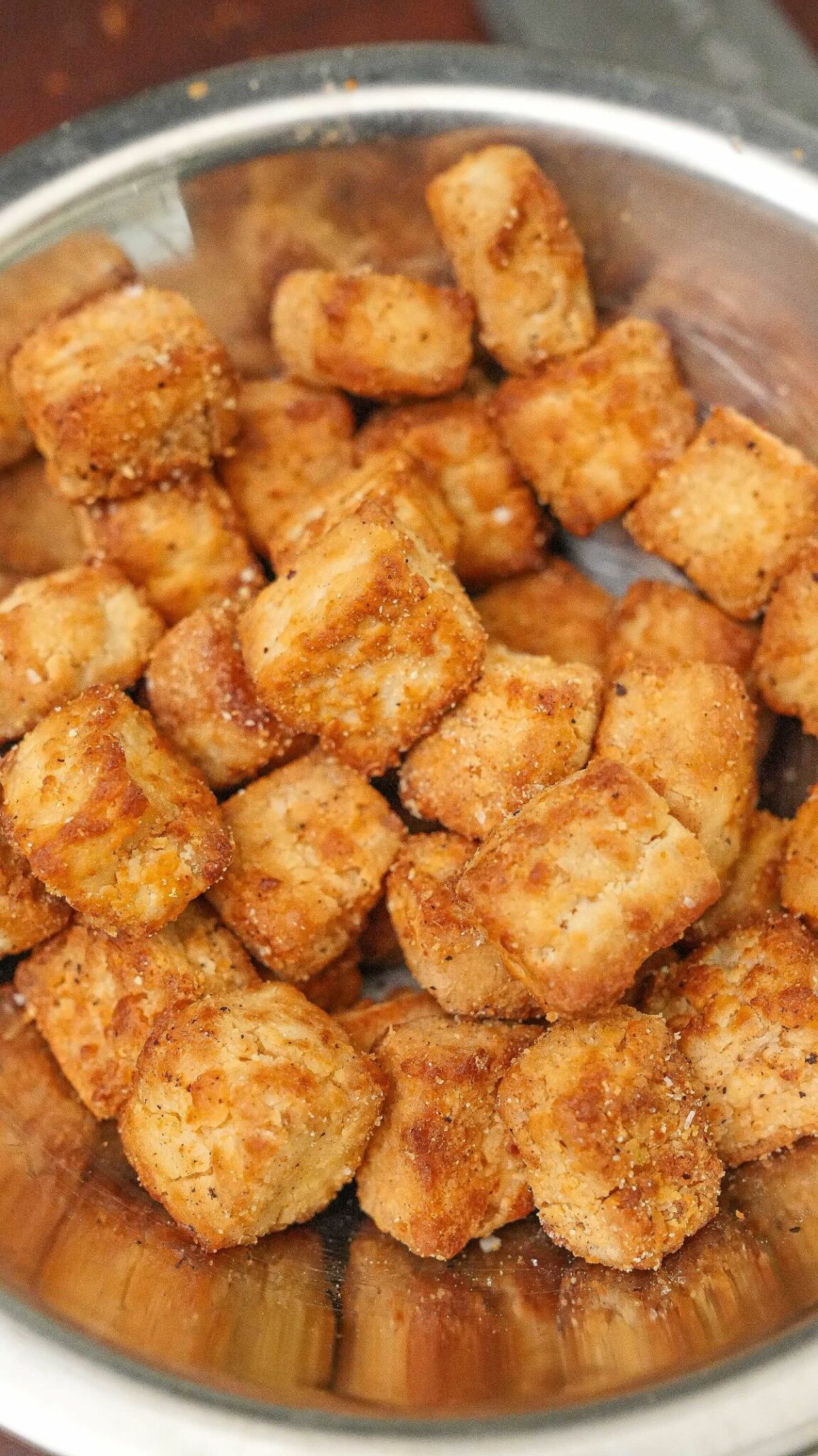Crispy Air Fryer Tofu seasoned in a bowl.