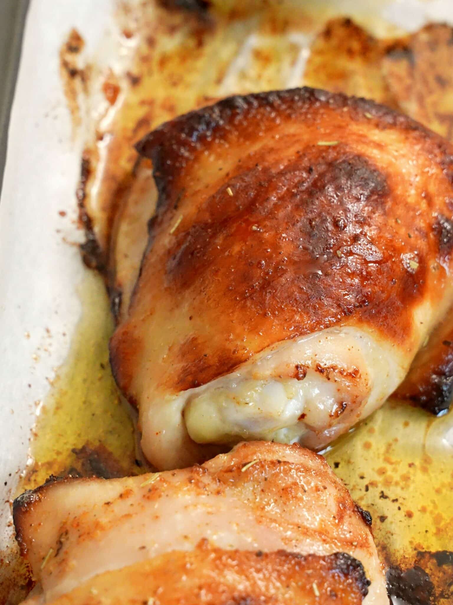 Baked Chicken Thighs on a baking sheet.