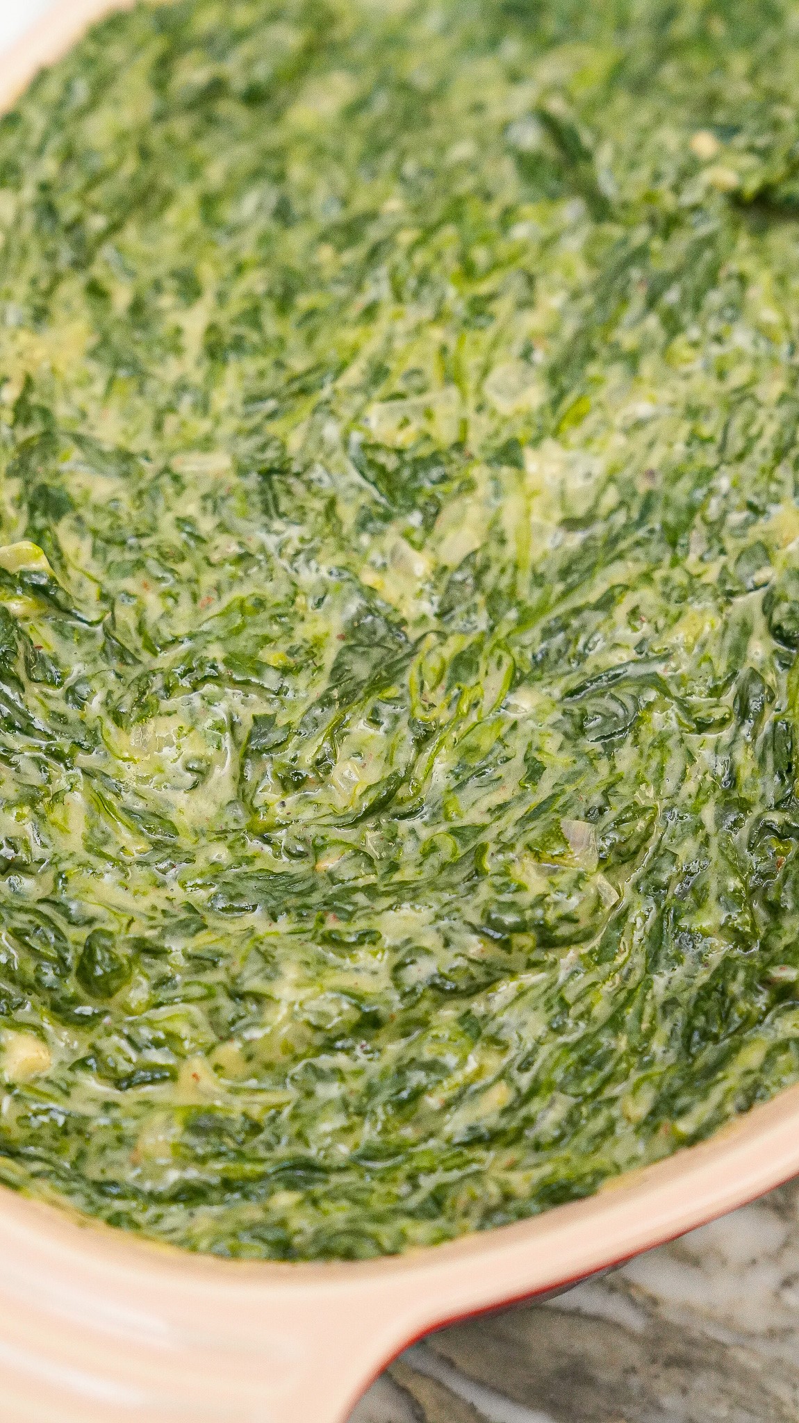 Creamed spinach in a plating dish.