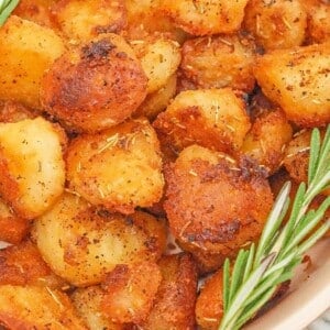 Roasted potatoes in a serving dish.