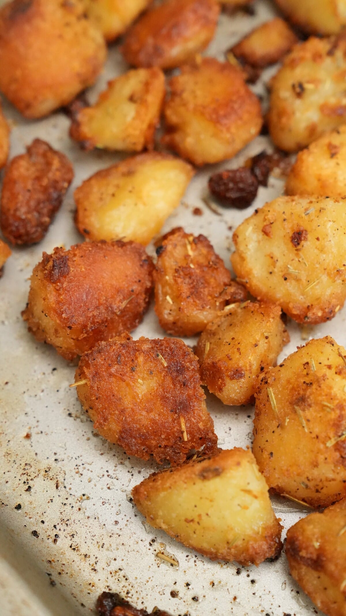 Perfect crispy roasted potatoes on a baking sheet.