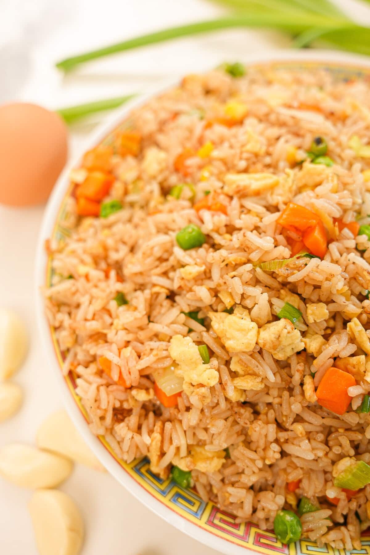 Egg fried rice on a plate.