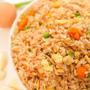 Egg fried rice on a plate.