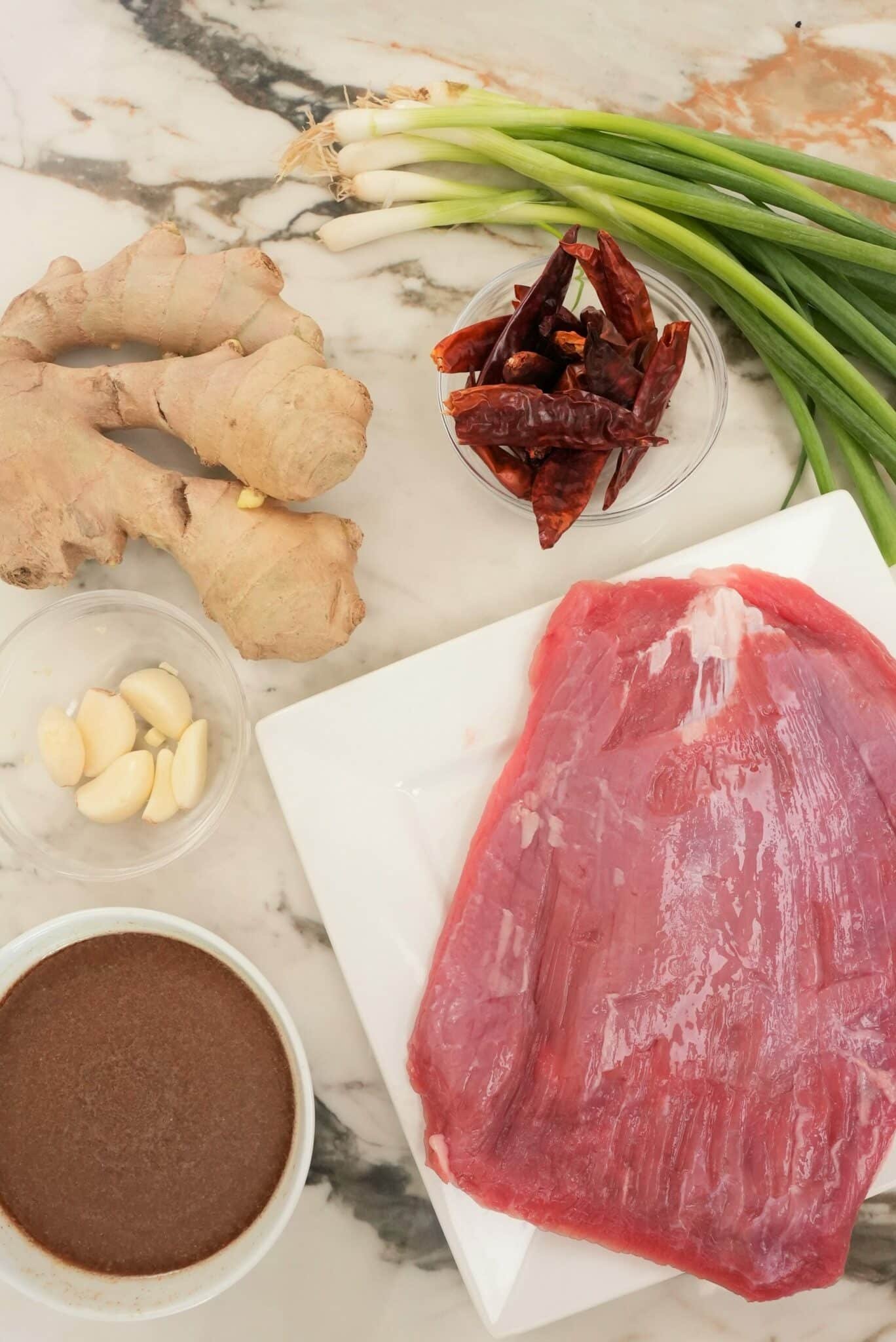 raw ingredients on a table for mongolian beef