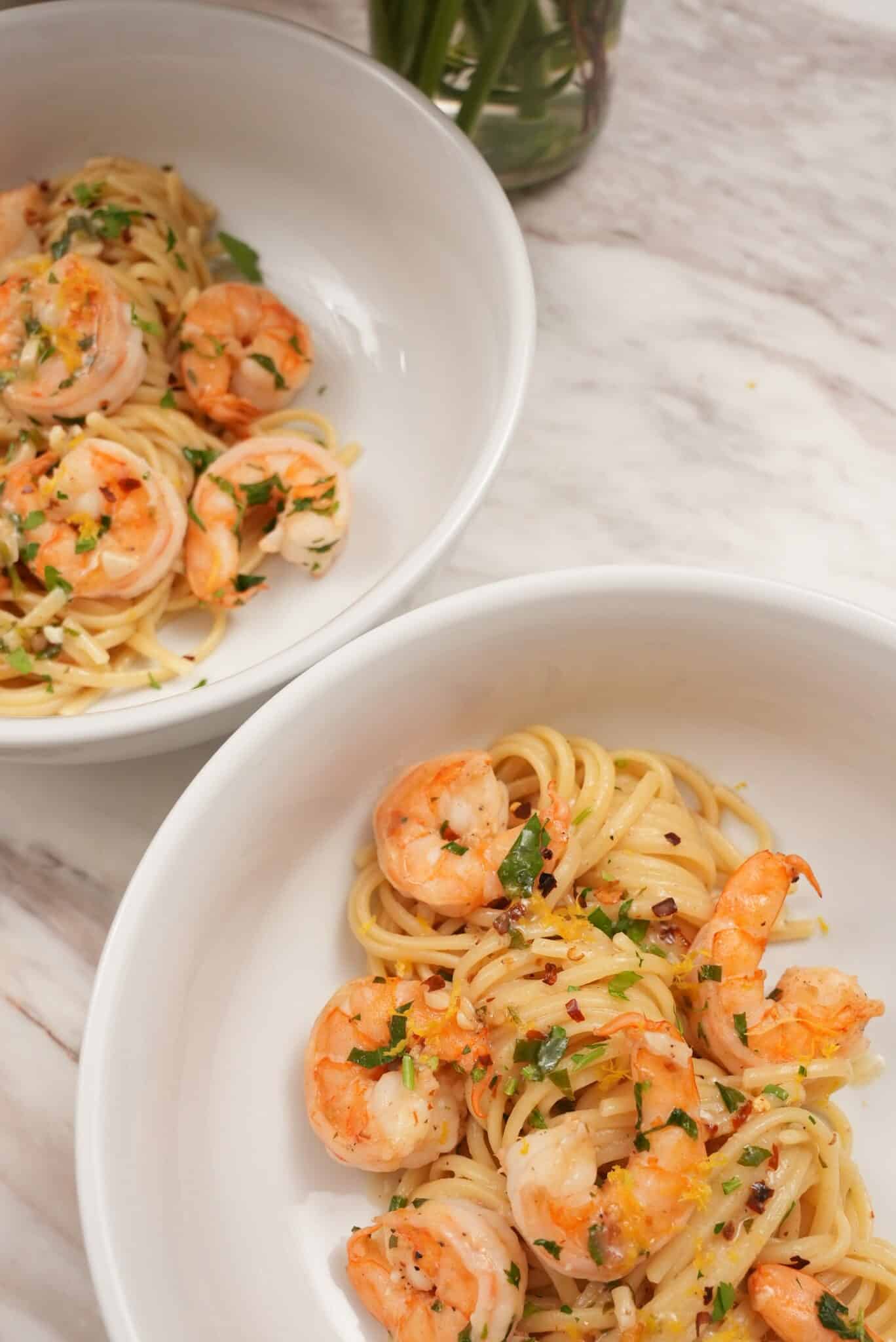 shrimp scampi pasta plated in bowls