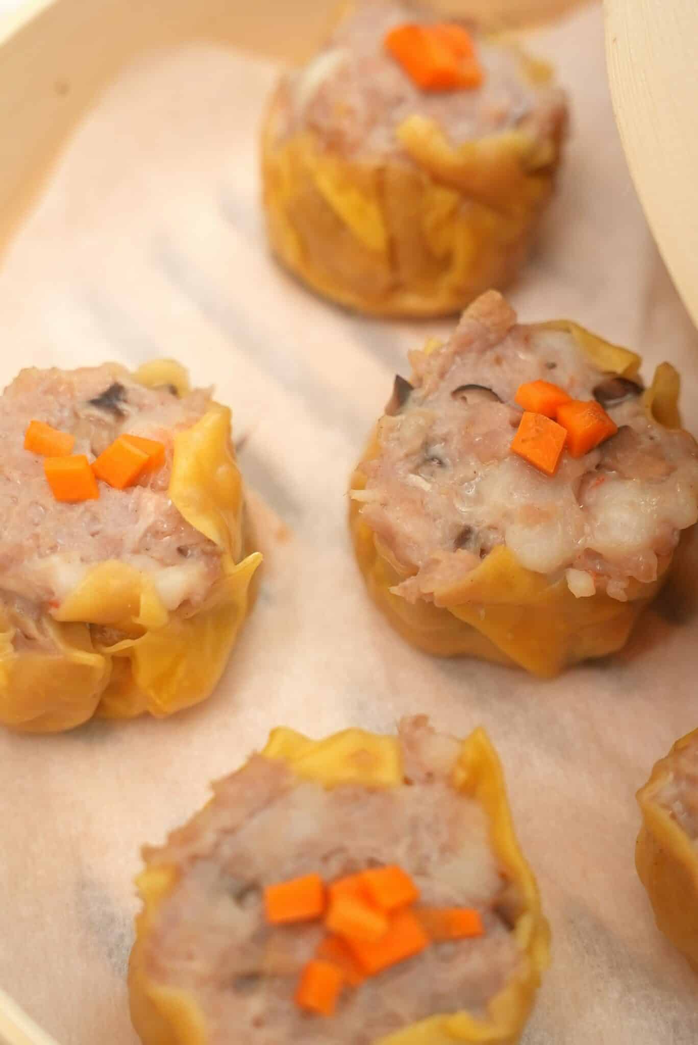 Siu Mai dumplings steamed in a steamer basket