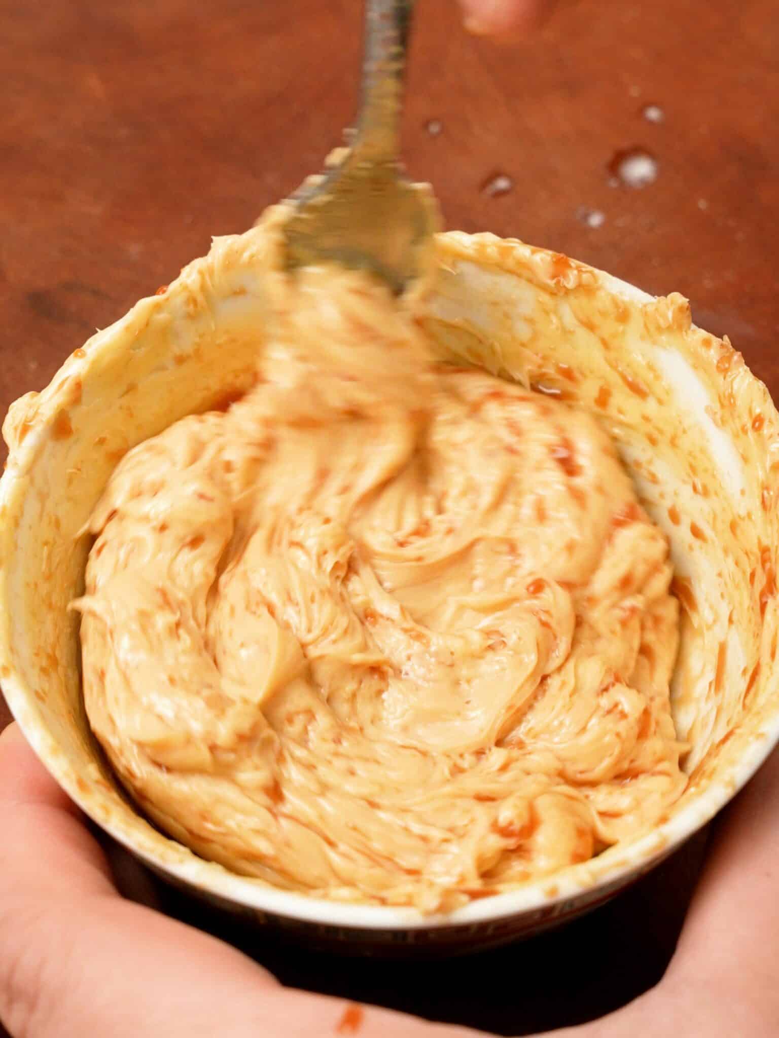 Mixing the soy garlic butter in a bowl.