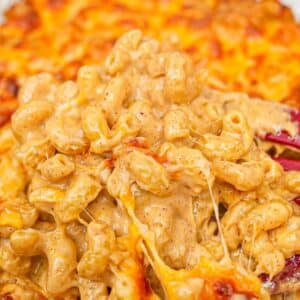 Creamy Baked Mac and Cheese in a casserole dish with cavatappi noodles.