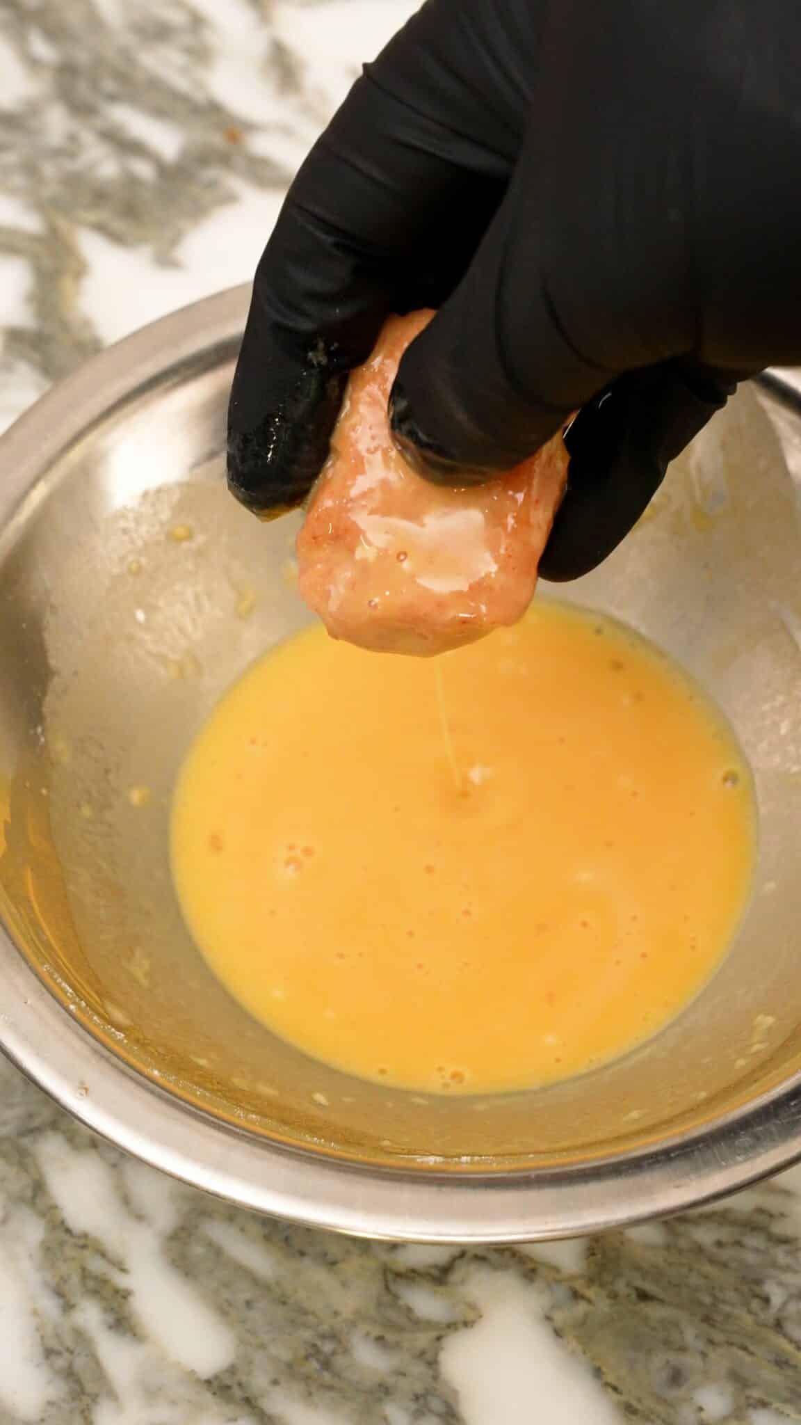 Air Fryer Chicken Nuggets dipped in a wet batter.