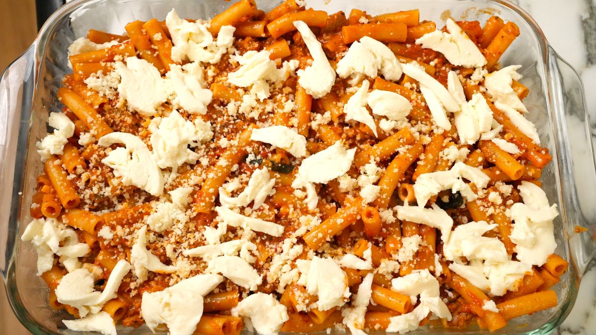 A completed dish of layered baked ziti before going into the oven to bake.