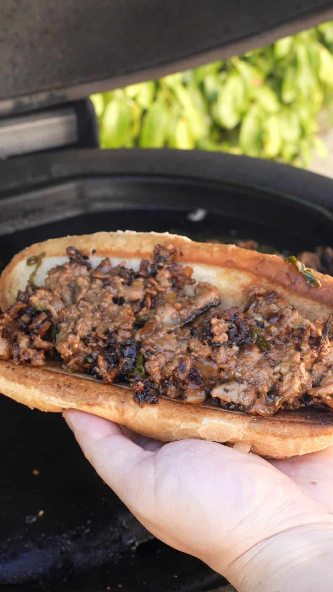 A bulgogi cheesesteak in a bun.