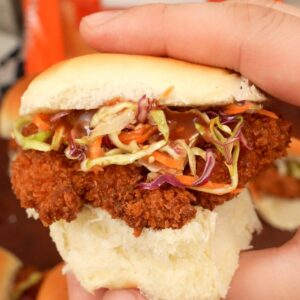 Chicken Katsu Sliders held in hands.