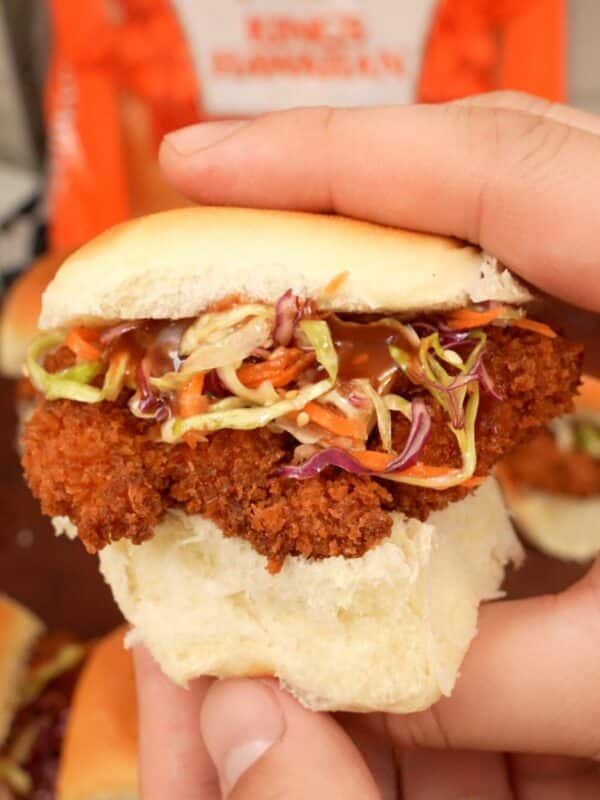 Chicken Katsu Sliders held in hands.