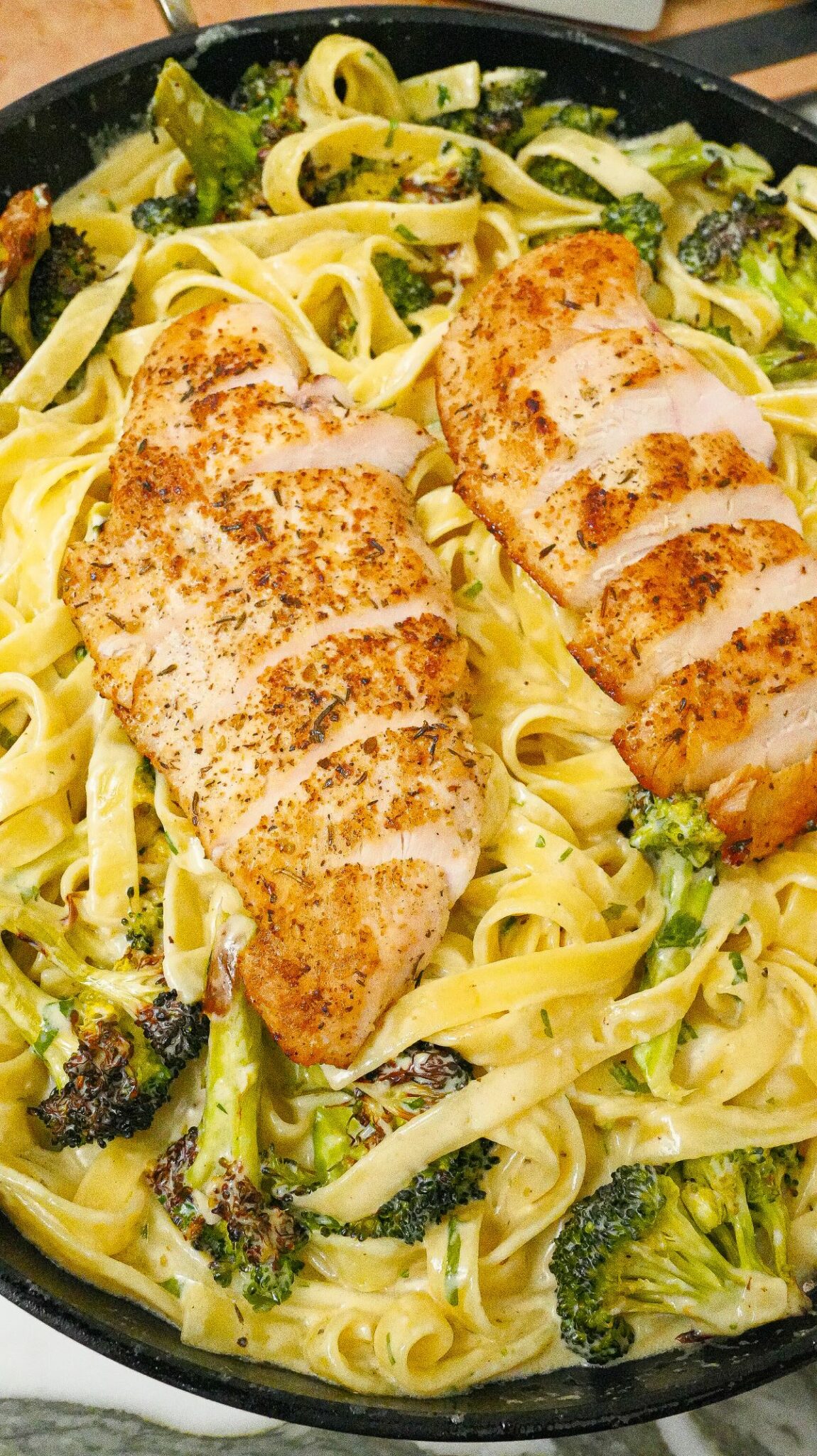 Chicken and Broccoli Fettuccine Alfredo in a pan.