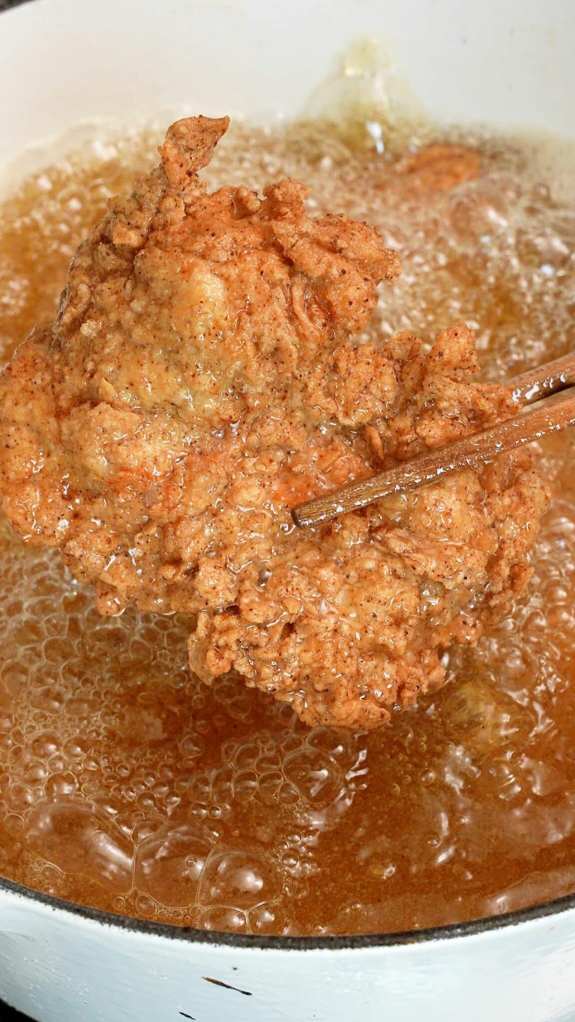 Korean fried chicken in a pot of oil.