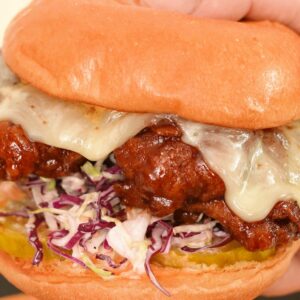 Korean Fried Chicken Sandwich held in hands.