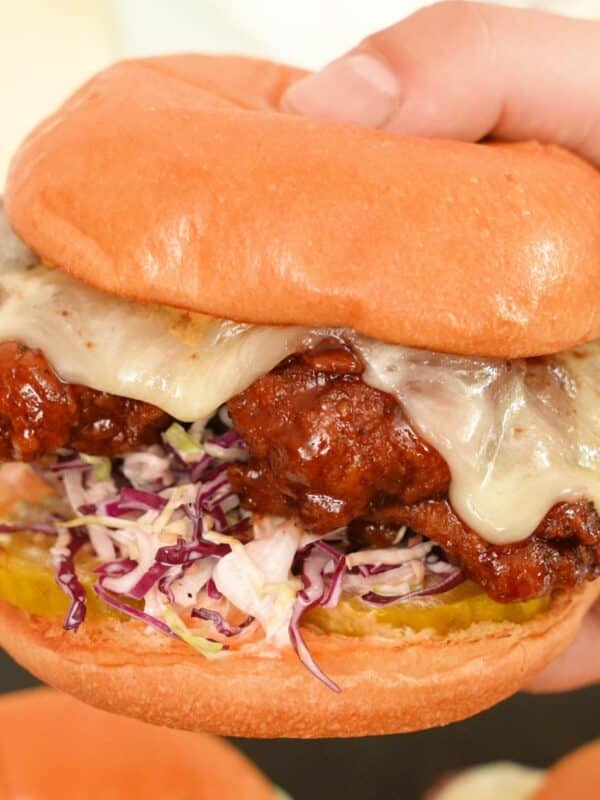 Korean Fried Chicken Sandwich held in hands.