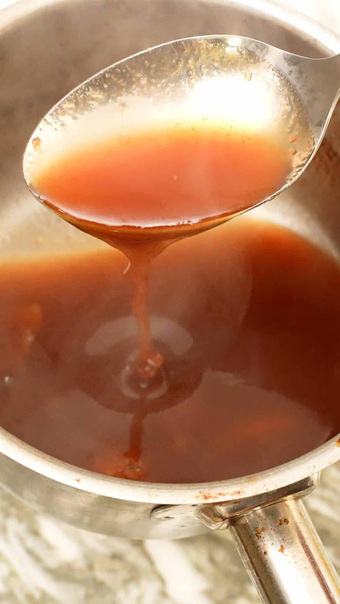 Sweet and sour sauce cooling in a pot.