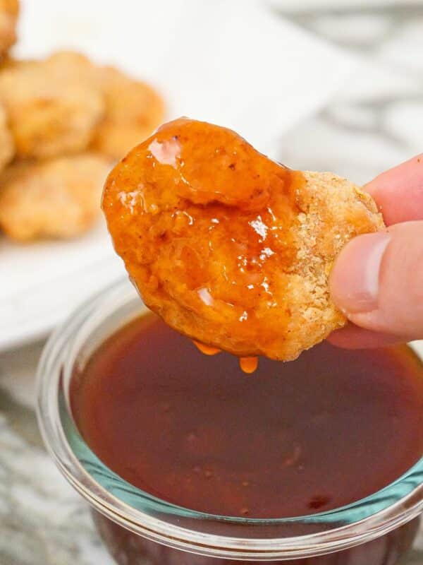 Sweet and sour sauce on a chicken nugget.