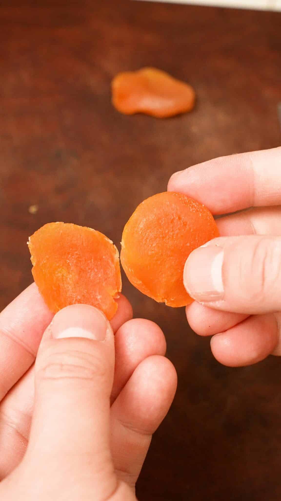 A dried apricot cut in half.