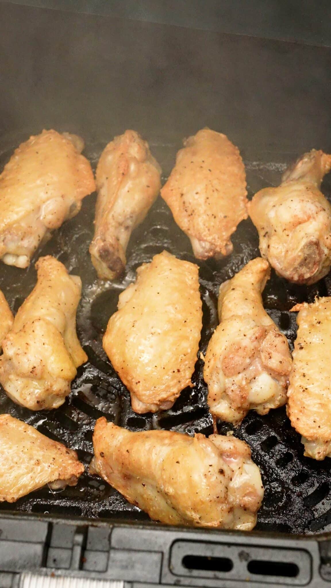 Chicken wings cooking in the air fryer.