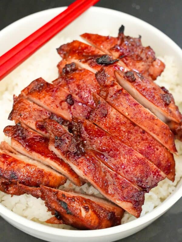 Char Siu Chicken over a plate of rice.