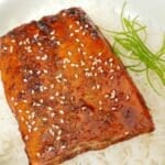 Honey Soy Glazed salmon over rice in a bowl.