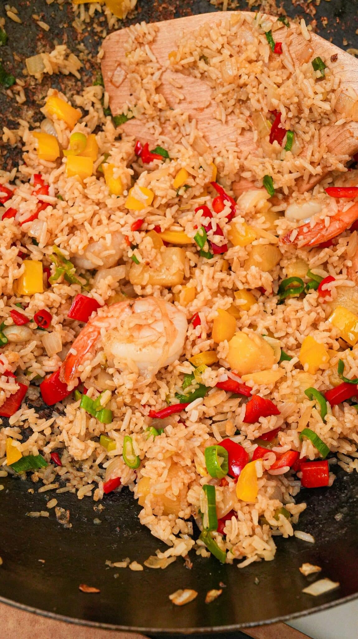 Pineapple Fried Rice with shrimp in a wok.