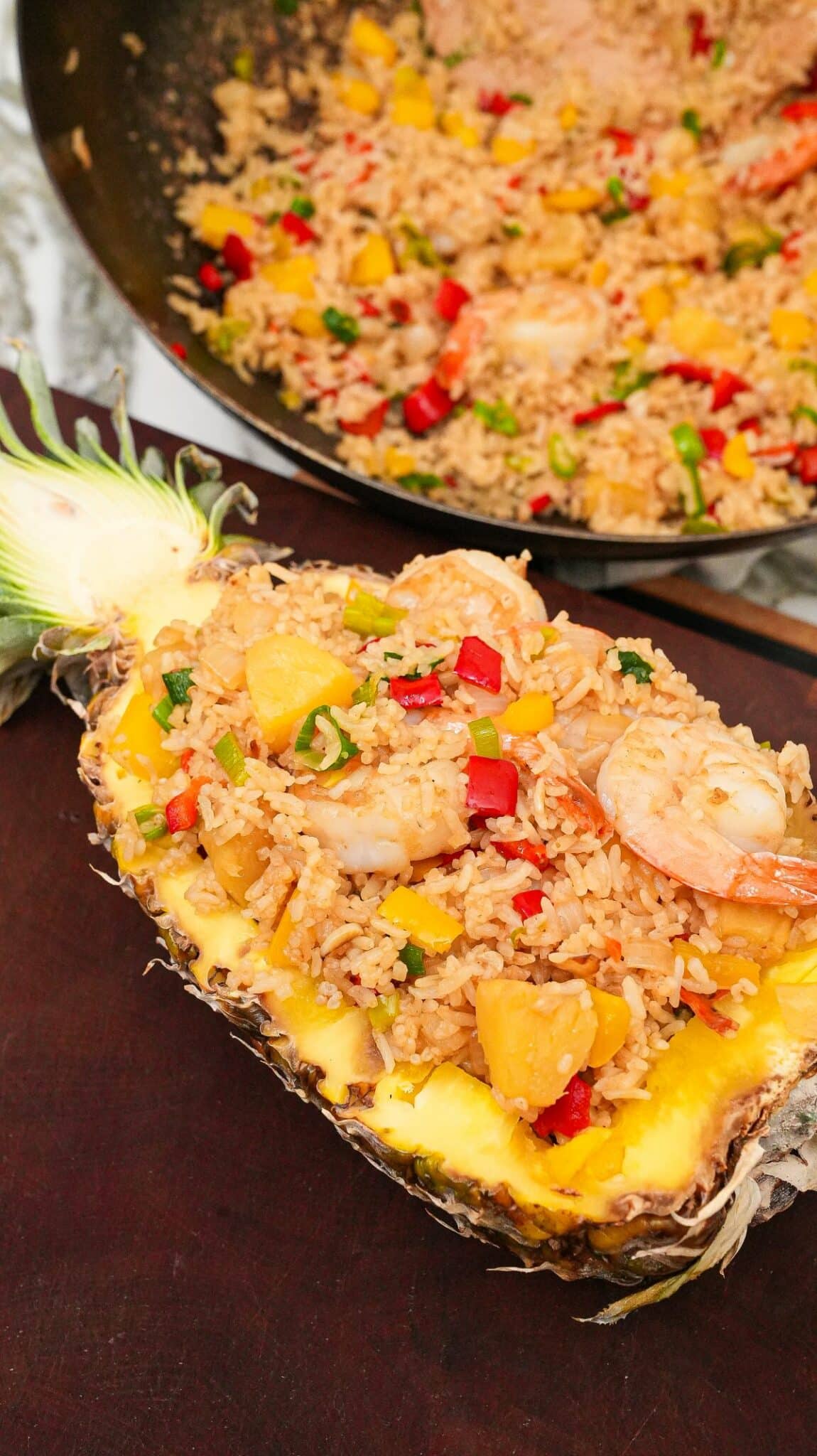 Pineapple Fried Rice plated in a carved out pineapple.