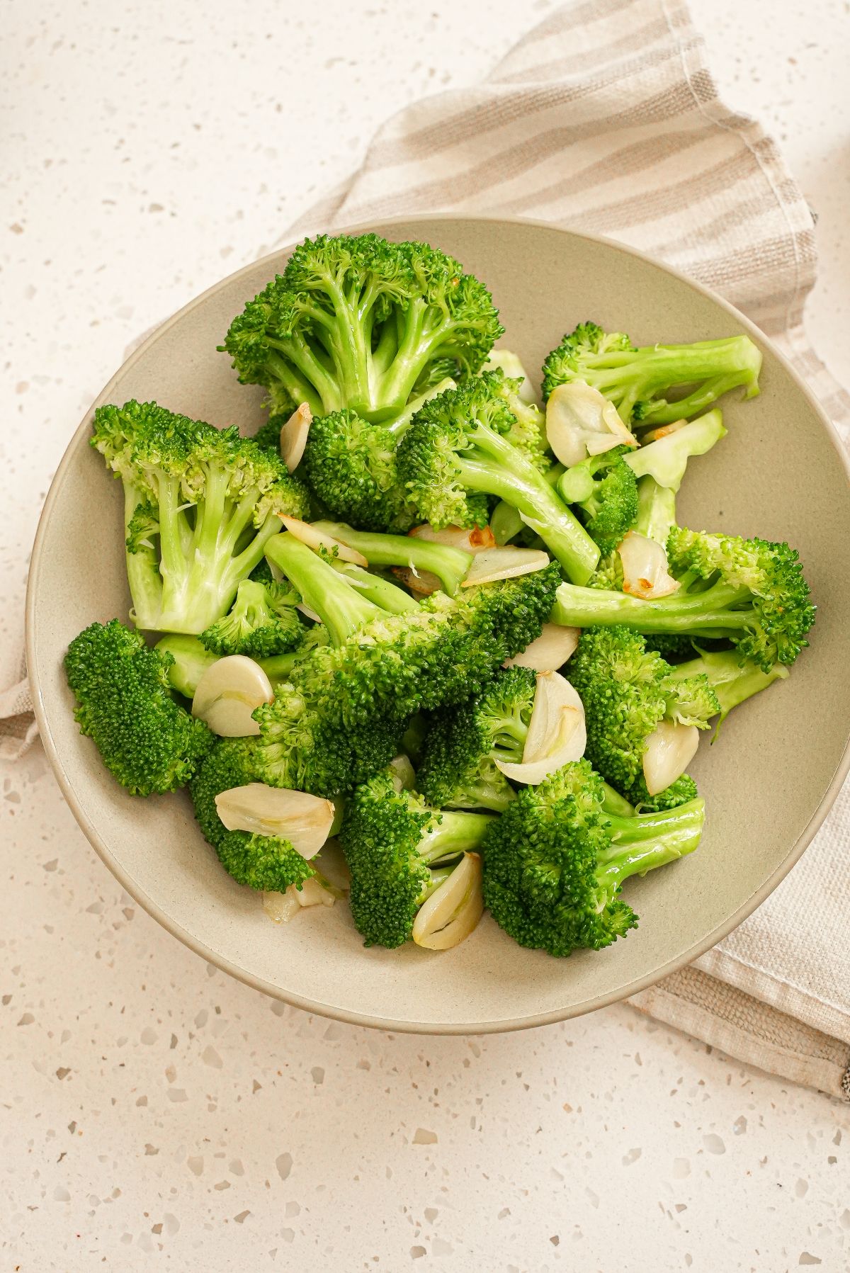 Din Tai Fung Broccoli with garlic in a bowl.