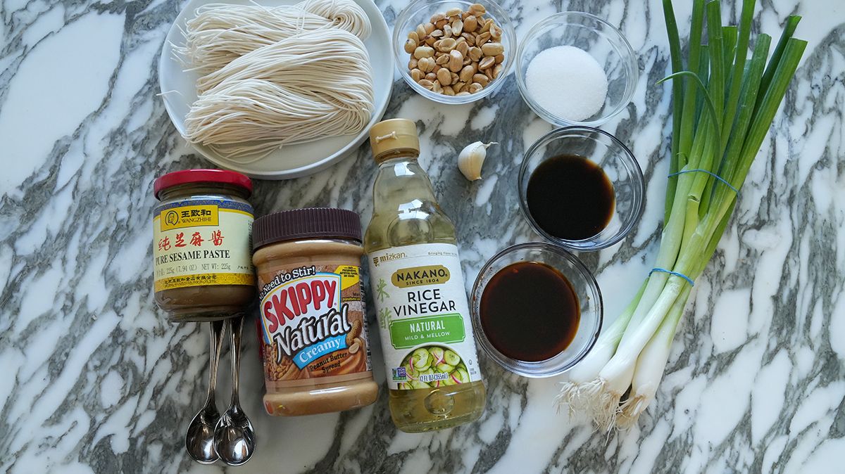 Raw ingredients for din tai fung noodles with sesame sauce on a table.