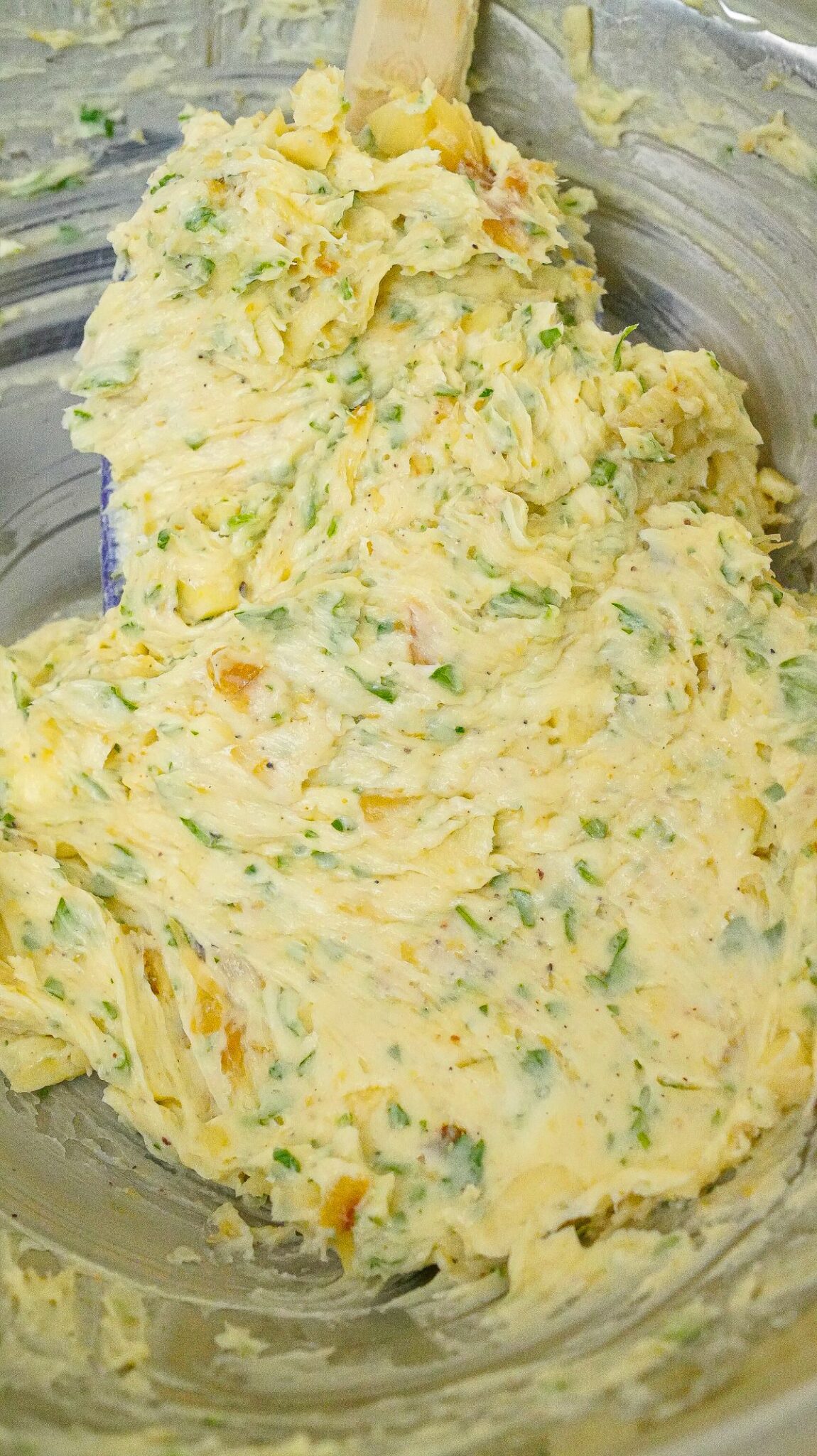 Roasted garlic butter mixed in a bowl.