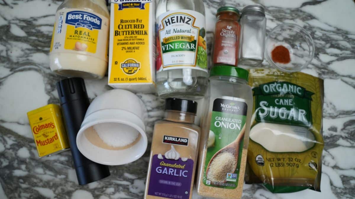 Raw ingredients for Popeyes blackened ranch on a table.