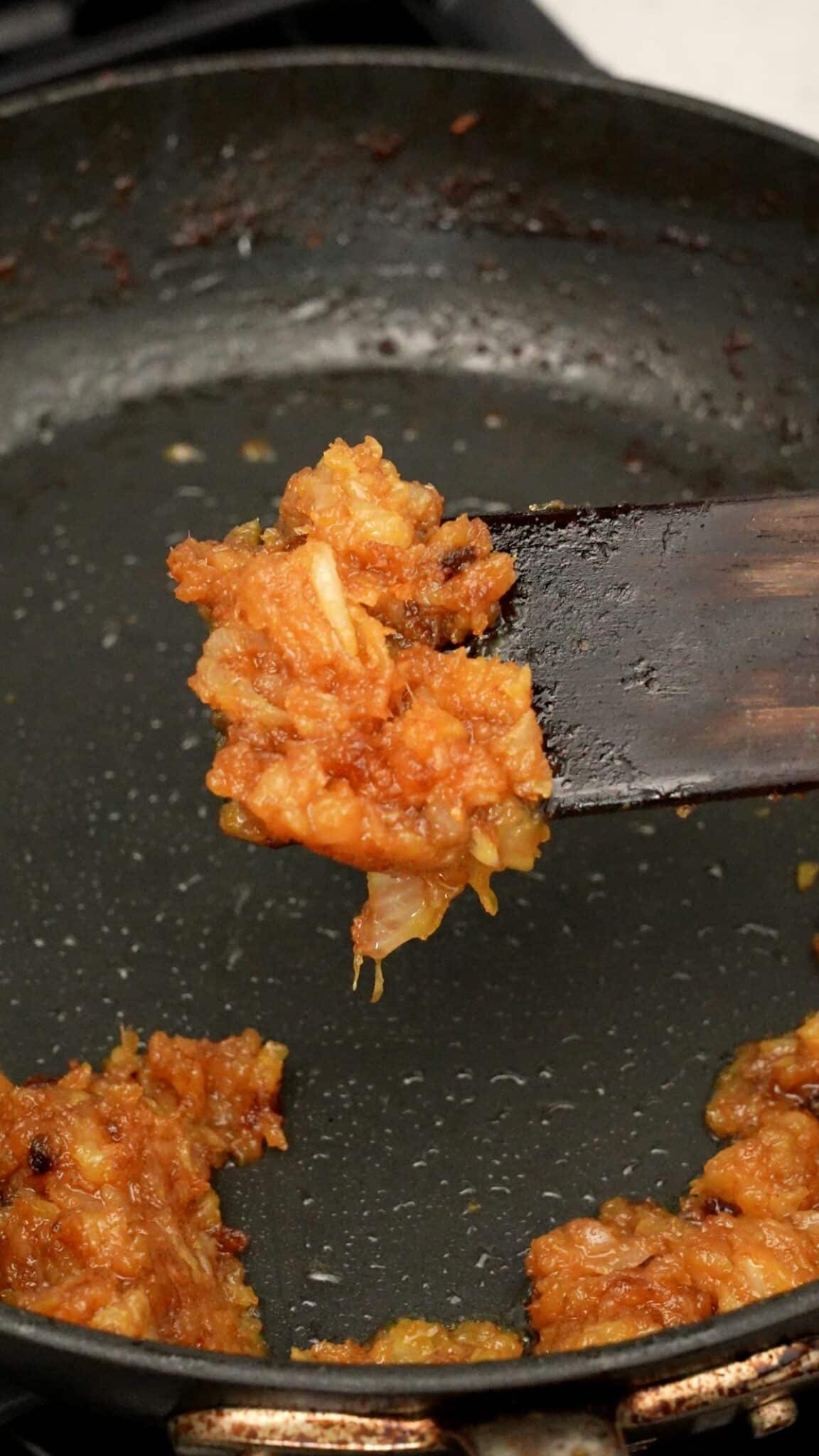 Cooked carmelized onions in a pan.