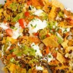 Air Fryer Nachos on top of parchment paper.