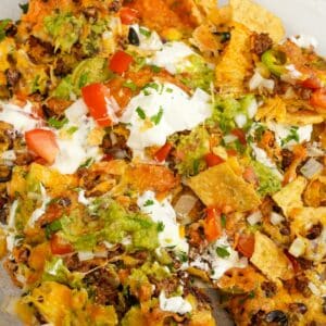 Air Fryer Nachos on top of parchment paper.