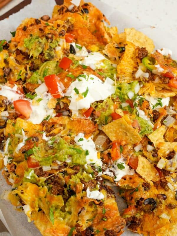 Air Fryer Nachos on top of parchment paper.