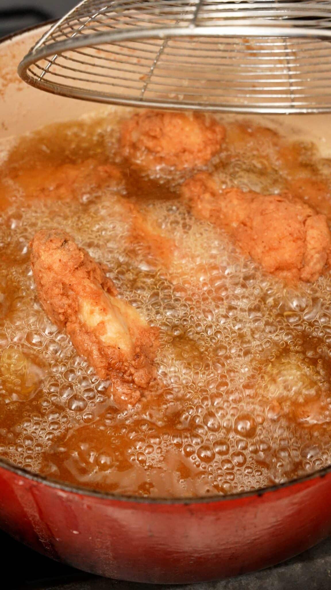 Wings frying in oil.