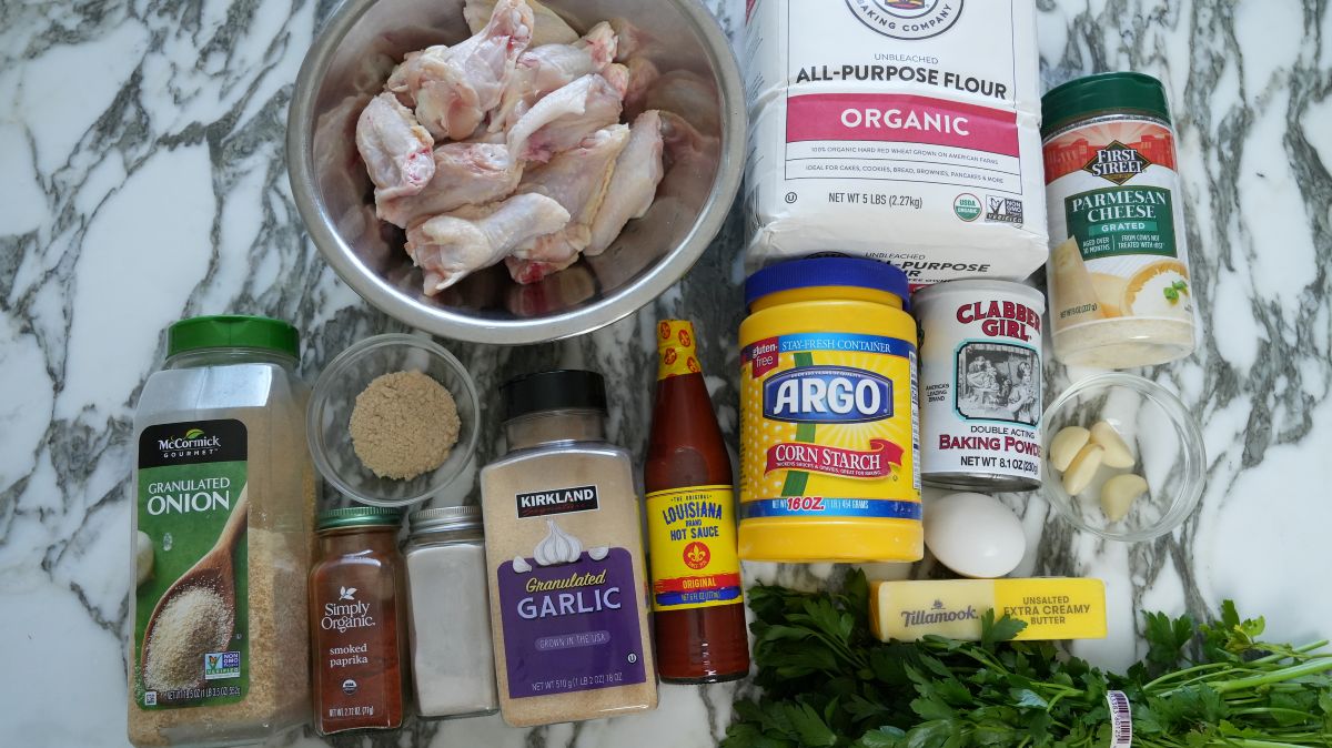 Raw ingredients for Garlic Parmesan Wings on a table.