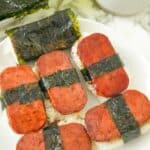 Spam Musubi on a plate with rice and seaweed.