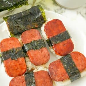 Spam Musubi on a plate with rice and seaweed.