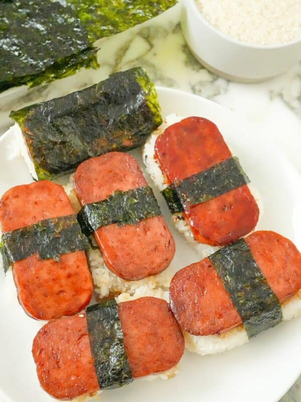 Spam Musubi on a plate with rice and seaweed.