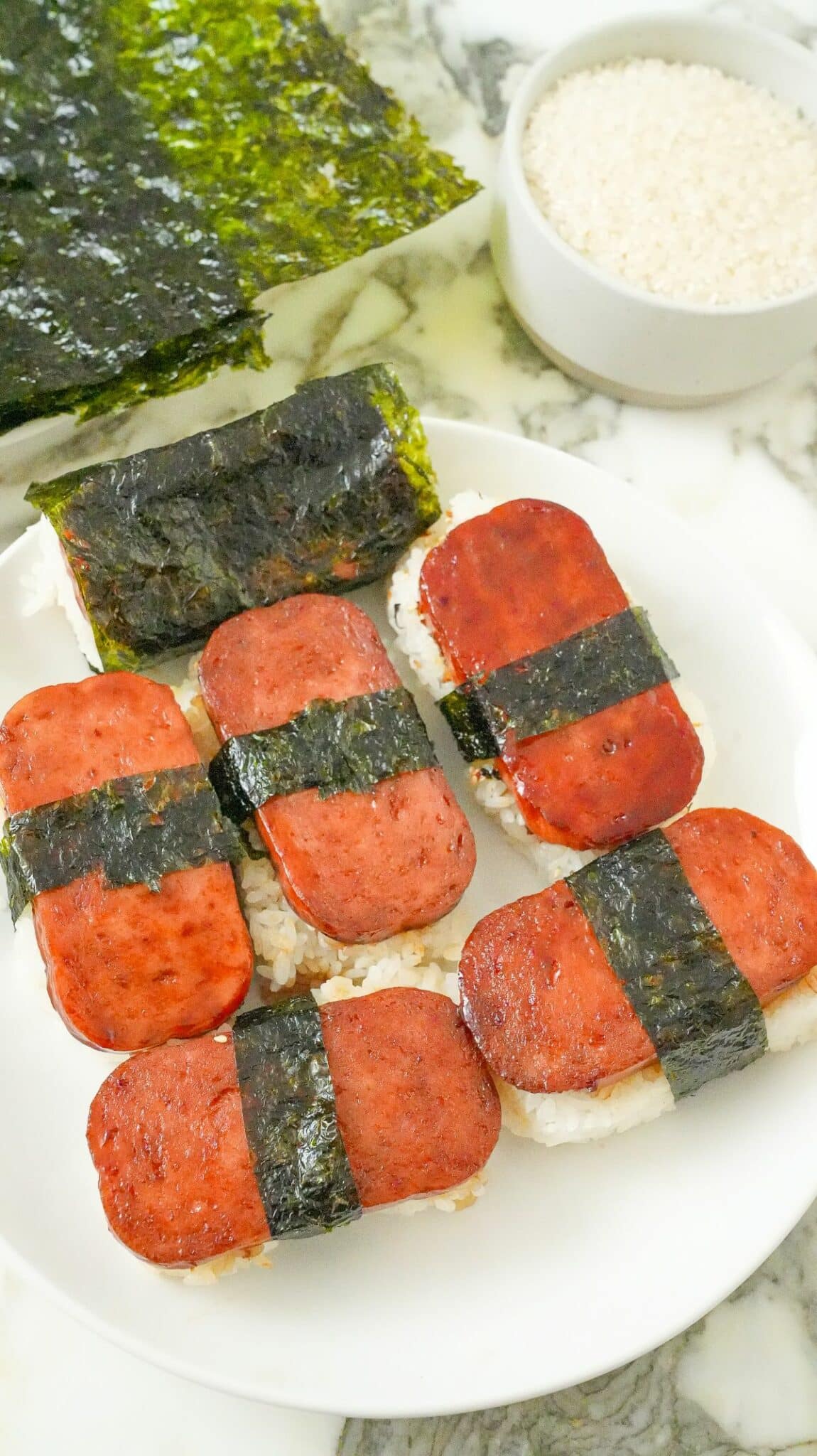 Spam Musubi on a plate with rice and seaweed.