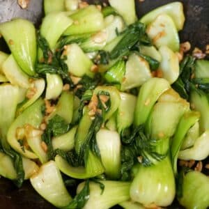Garlic Bok choy cooked in a wok with fresh garlic, salt, and sugar.